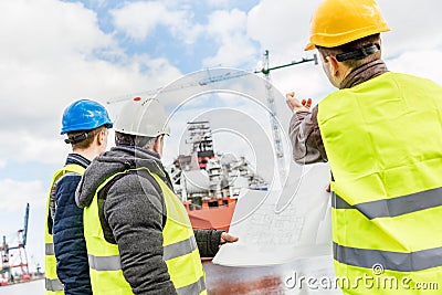 Shipbuilding engineers introducing new solution. Stock Photo