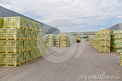 Shipment, logistics, delivery and product distribution-business industry. Storage warehouse with cardboard boxes with packed goods Editorial Stock Photo