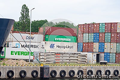 Shipping containers OOCL brand are waiting for loading. International transport. Concept of export and import by ships Editorial Stock Photo