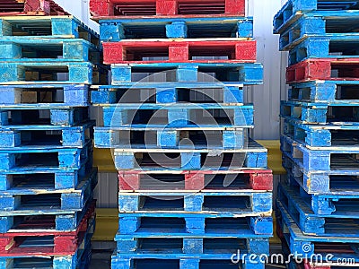 shipping receiving palate wood stacked palates trucking logistics wooden painted blue cargo generic strong support rack warehouse Stock Photo