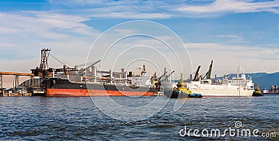 Ships being loaded Stock Photo