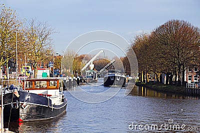 Ships in canal with lifting bridge Stock Photo