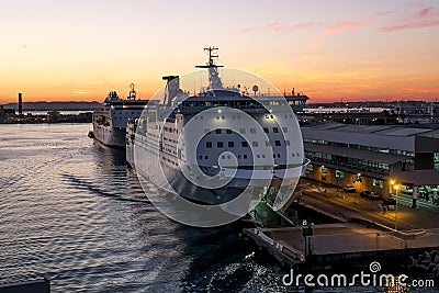 Ships and ferries in the port of La Gullet in Tunisia at sunset Editorial Stock Photo