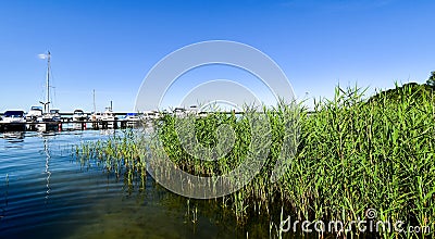 Ships moored at Fleesen Lake jetty in Germany Stock Photo