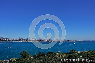 Ships sail on the blue surface of the Bosphorus. Stock Photo