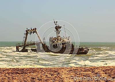 Shipwreck close to shore on Skeleton Coast, Namibia Stock Photo