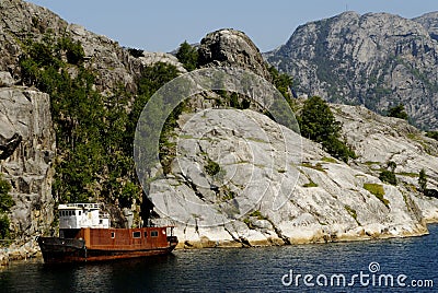 Shipwreck in fjord Stock Photo