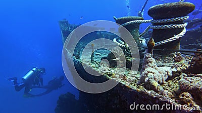 Shipwreck Thistlegorm and scuba divers on the background Stock Photo