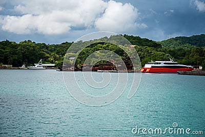 Shipwreck at the shore of Roatan Honduras on the background of the lush vegetation Editorial Stock Photo