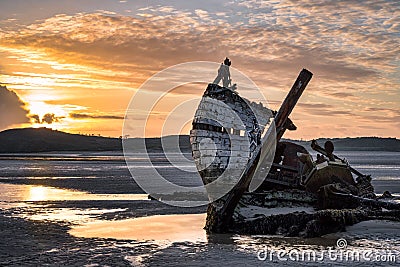 Shipwreck at Sunset Stock Photo