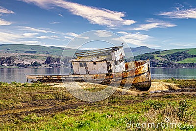 Shipwrecked and burnt old boat on the sand near Point Reyes, California. Stock Photo