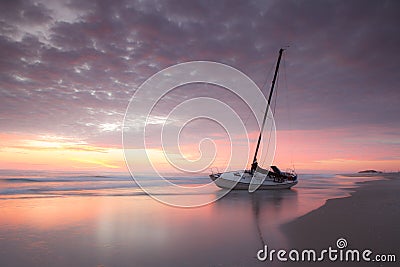 Shipwrecked Sailboat on Shoreline North Carolina Outer Banks Stock Photo