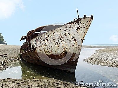 Shipwrecked ship. Old rusty ship Stock Photo