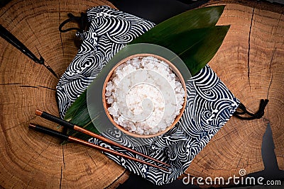 Shirataki rice or noodles on wooden table background. Konnyaku from konjac yam for wok. Healthy japanese diet. Gluten free, KETO Stock Photo