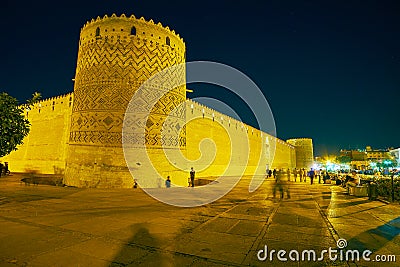 SHIRAZ, IRAN - OCTOBER 14, 2017: Enjoy medieval Karim Khan Citadel in bright evening illumination, surrounded by pleasant gardens Editorial Stock Photo