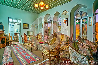 SHIRAZ, IRAN - OCTOBER 14, 2017: Family restaurant in historic mansion: the room is decorated in classic style with vintage carved Editorial Stock Photo