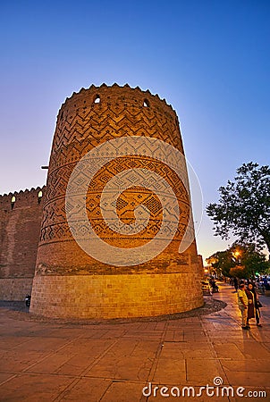 SHIRAZ, IRAN - OCTOBER 14, 2017: The medieval brick tower of Karim Khan citadel is covered with relief brick pattern, on October Editorial Stock Photo