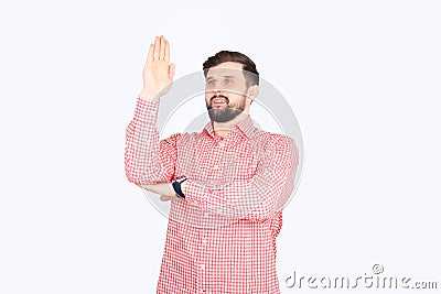 Shirt with a beard raised his hand in front of him as if he wanted to be noticed Stock Photo