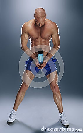 Shirtless Athletic Young Man Holding Water Bottle Stock Photo