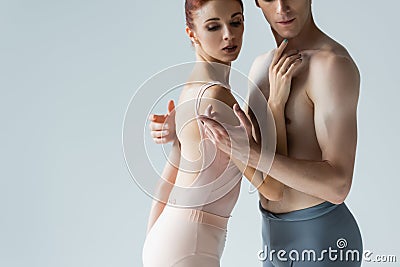 shirtless dancer hugging ballerina isolated on Stock Photo