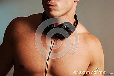 Shirtless male deejay Stock Photo