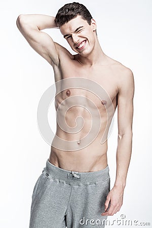 Shirtless young man on light background Stock Photo