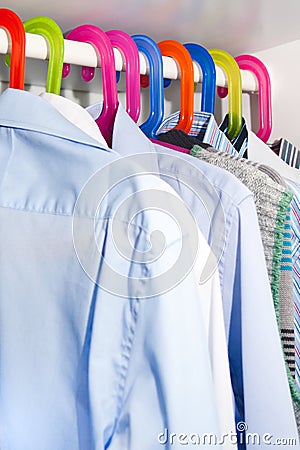 Shirts Hanging On Colourful Hangers Stock Photo