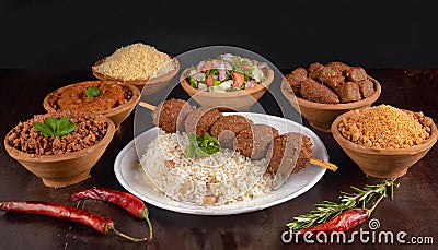 Shish kebab with mixed rice, kibbe and variety of ethnic lebanese food. Stock Photo