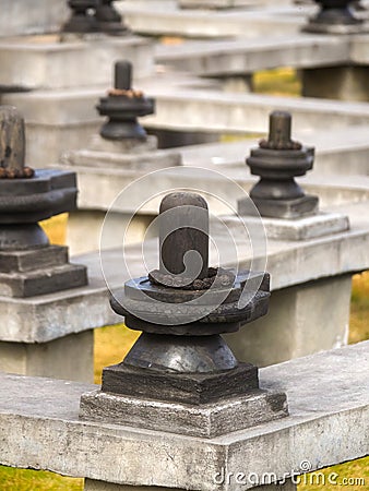 Shiva Lingam stone wrapped around with Rudraksha at meditation maze in Dhulikhel, Nepal Stock Photo