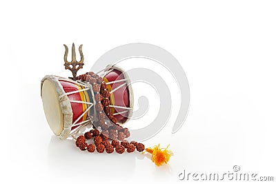 Shivaratri background with Shivas trident and Pellet Drum Damroo musical instrument . Hindu festival Maha Shivratri Stock Photo