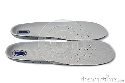 Shock absorbing sports insoles isolated on white background top view. Foam and silicone in the composition, top covering in soft, Stock Photo