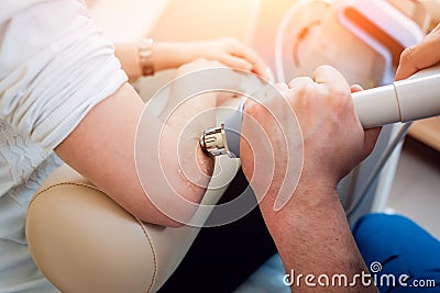 Shock wave therapy. The magnetic field, rehabilitation Stock Photo