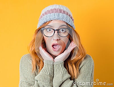 Shocked beautiful woman standing with positive surprised face expressing, isolated on yellow background. Crazy pretty girl Stock Photo