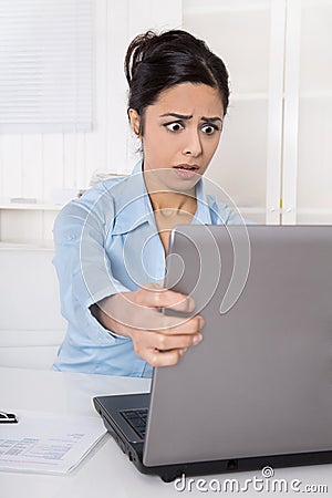 Shocked businesswoman forgotten her password or is victim of com Stock Photo