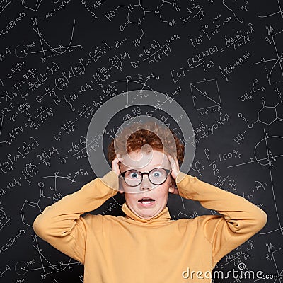 Shocked child and science formulas Stock Photo