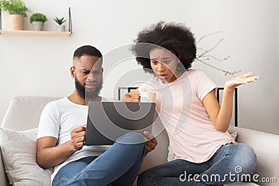 Shocked couple have problems with buying online Stock Photo