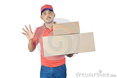 Shocked delivery man holding carton box in uniform Stock Photo