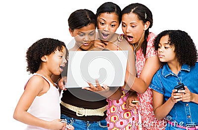 Shocked friends using a laptop Stock Photo