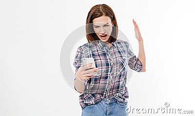 Shocked frustrated young woman with phone. Female with anger on cell phone. Portrait of an angry brunette woman screaming on Stock Photo