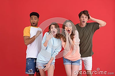 Shocked group of friends with mouth opened. Stock Photo