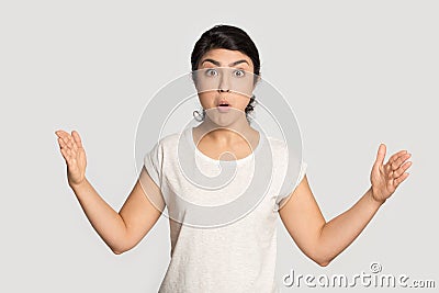 Shocked indian girl show big size measurement by hands Stock Photo