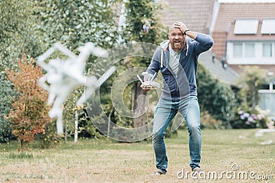 Shocked man with broken drone Stock Photo