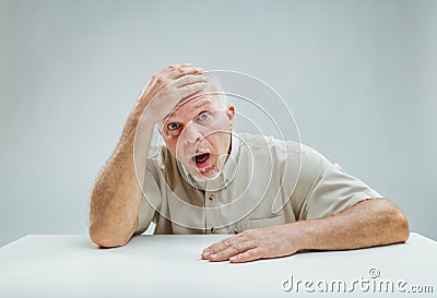 Shocked man receives startling information, shows disbelief Stock Photo