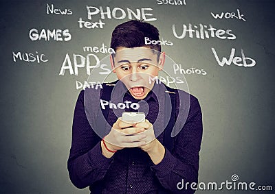 Shocked man using smart phone Stock Photo