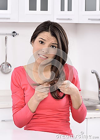 Shocked and sad woman - broken hair after coloration. Stock Photo