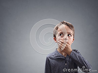 Shocked and surprised child looking into copy space Stock Photo