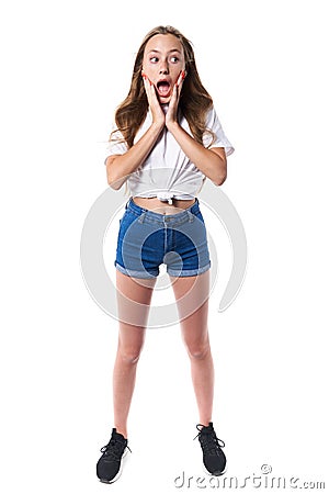 Shocked teen standing over white background shouting Stock Photo