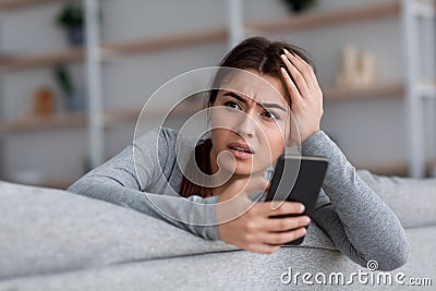 Shocked upset anxiety worry european millennial female going through breakup, saddened by bad news Stock Photo
