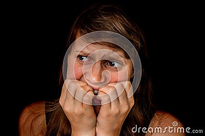 Woman with claustrophobia is alone in the dark place Stock Photo