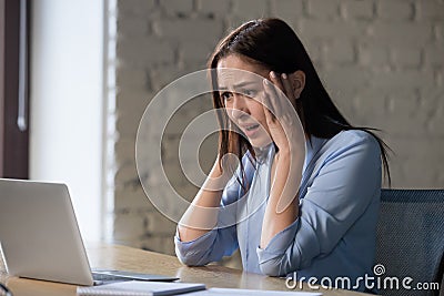 Shocked woman feels desperate reading bad online email news Stock Photo